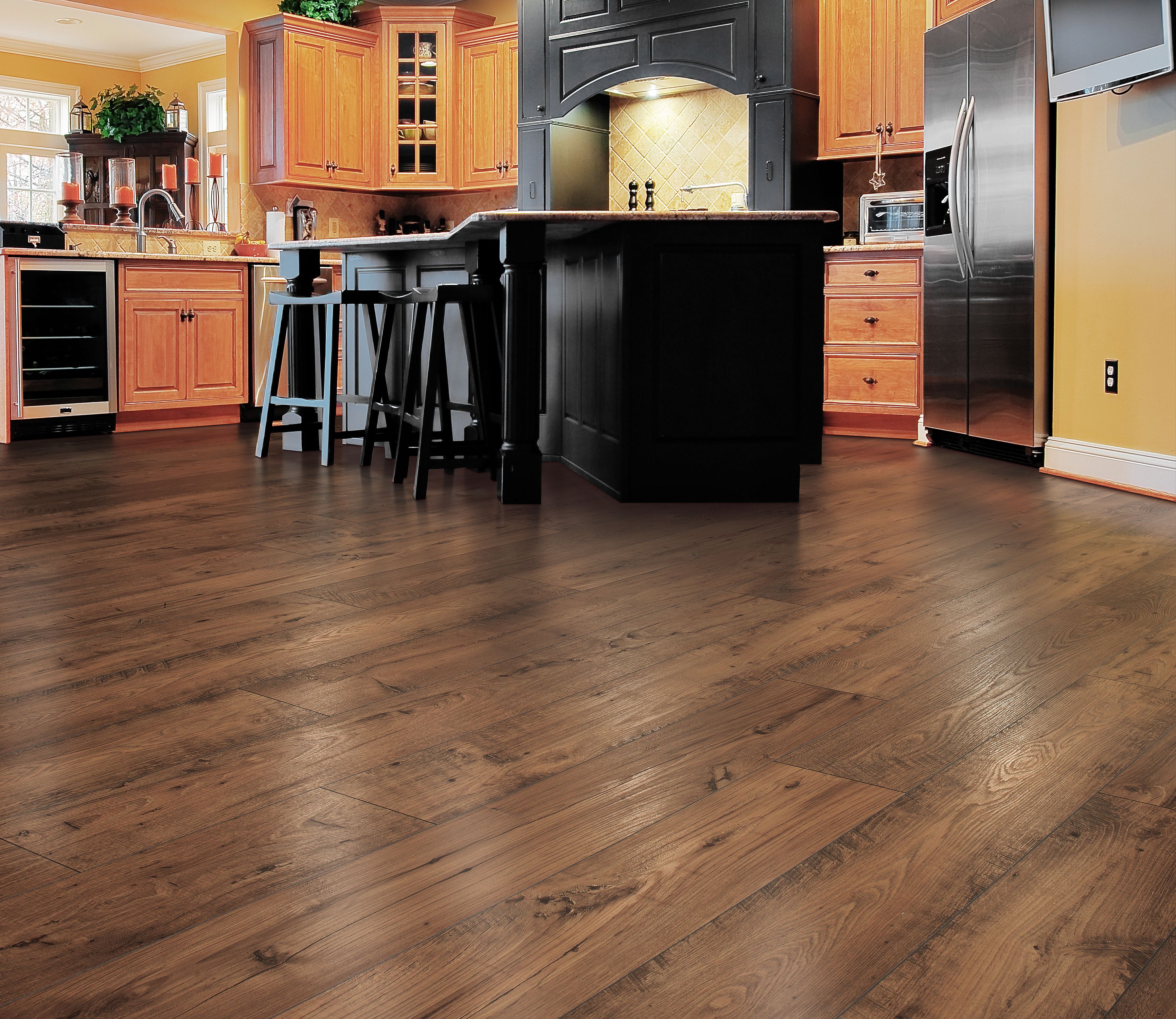 Kitchen with warm wood-look laminate flooring