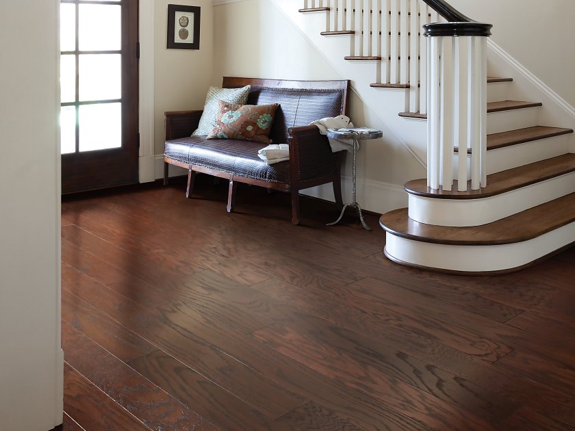 Entryway and staircase with rich hardwood flooring